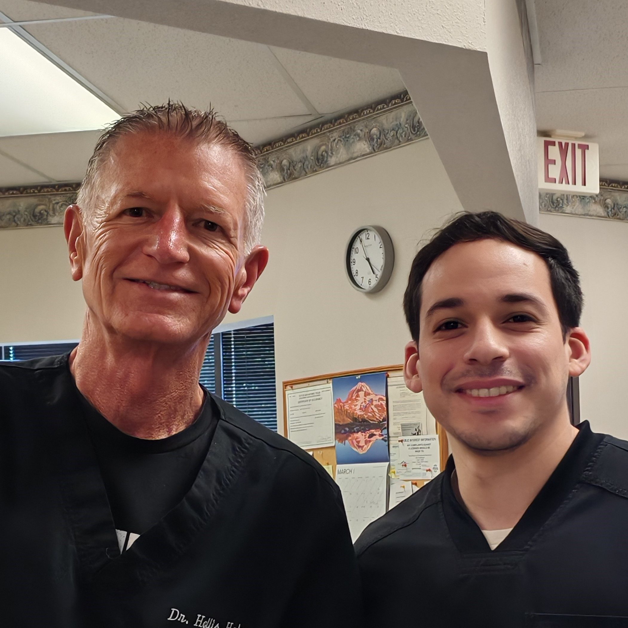 Chiropractor Hollis Helms and Noah Salinas Smiles Warmly at the viewer welcoming patients